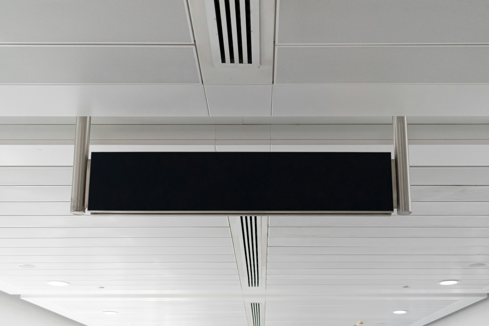 Linear air diffuser in a white ceiling