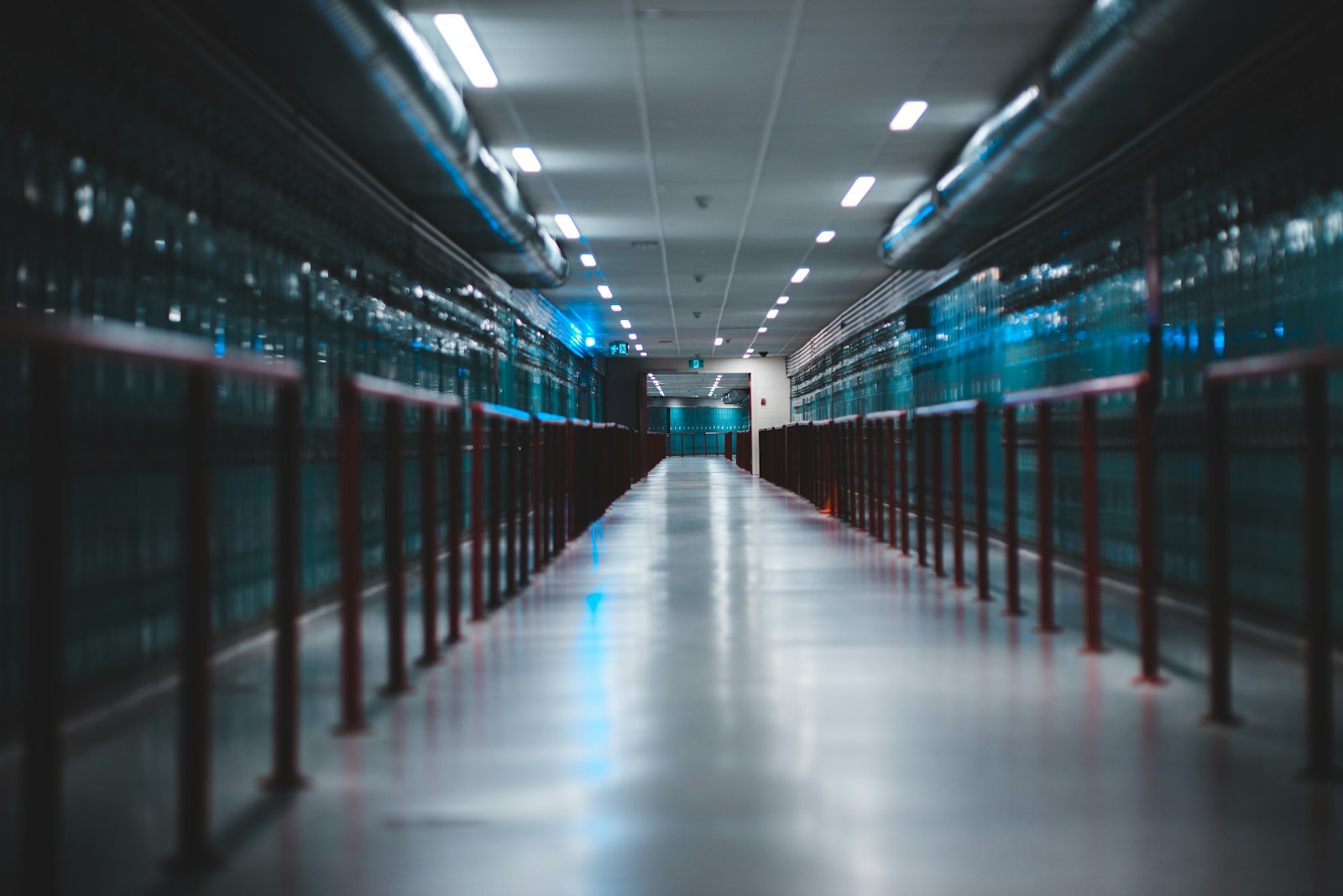 Data center aisle lit in blue