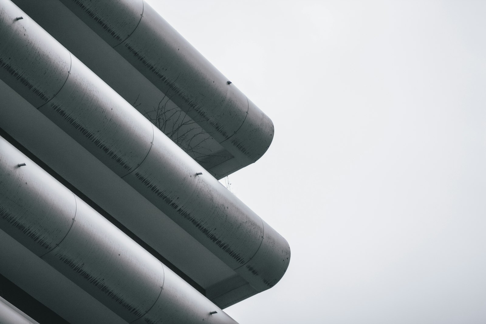 Insulated pipes against the sky