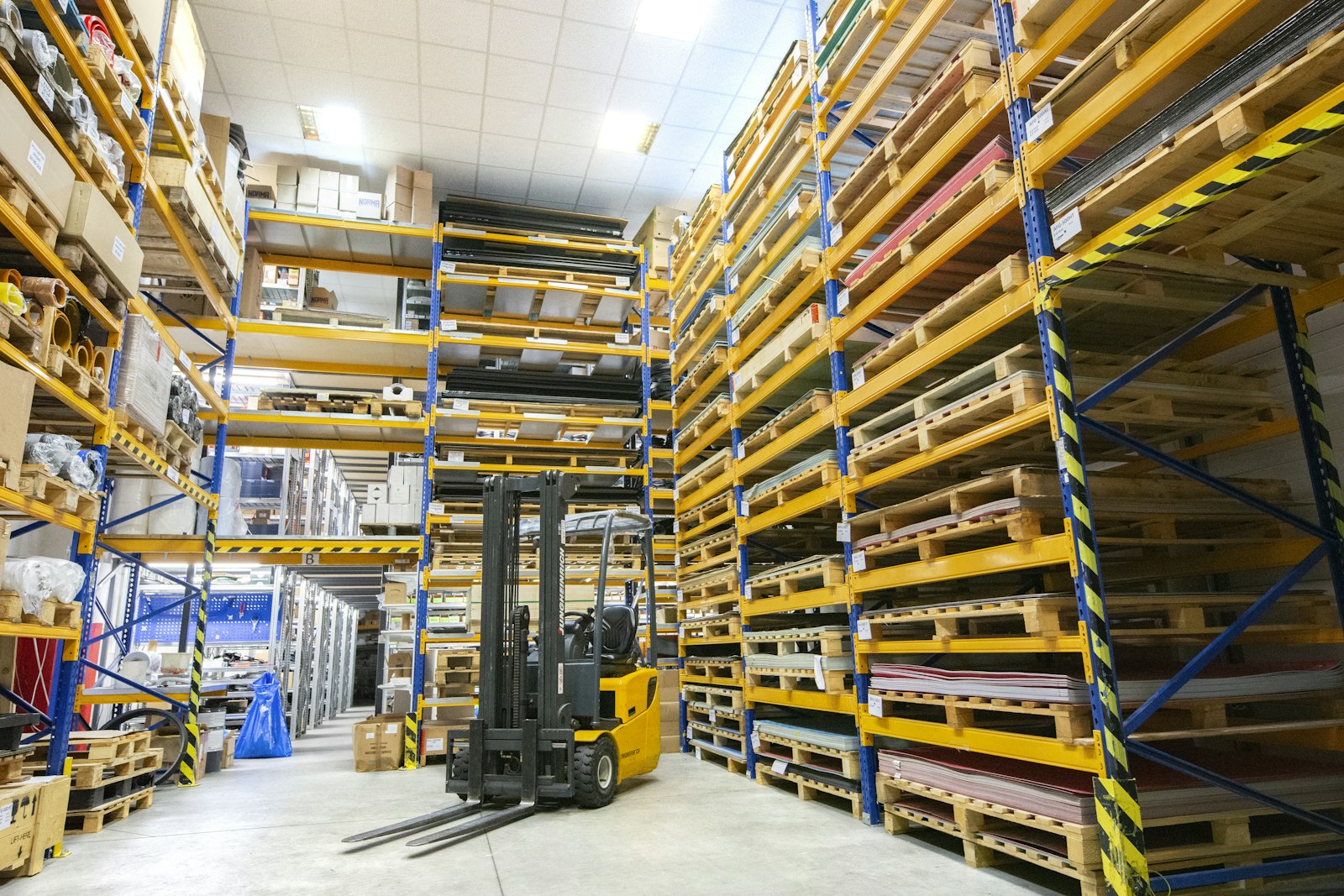 Warehouse racking with a forklift